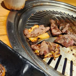 steaks on a grill