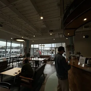 a man standing in a coffee shop