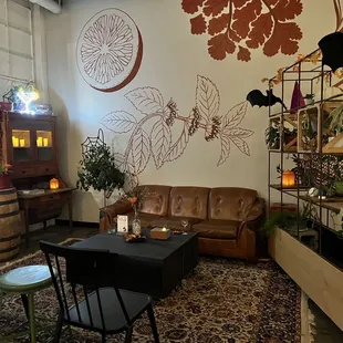 a living room with a couch, table and chairs