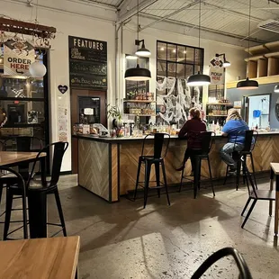 two people sitting at the bar