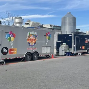 a food truck with balloons on the side