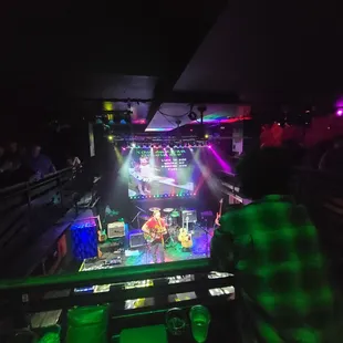 a man standing in front of a stage