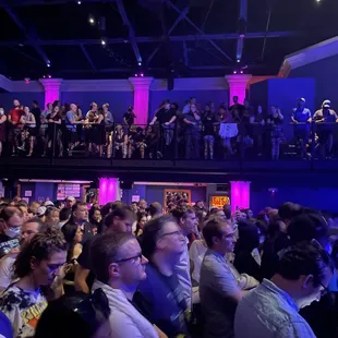 a crowd of people watching a concert