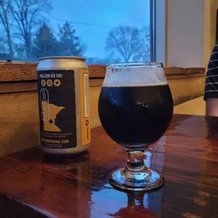 a can and a glass of beer