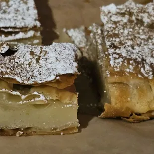 a pastry with powdered sugar on top