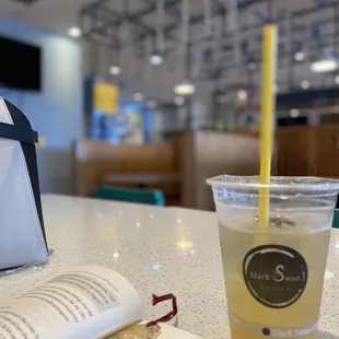 a book and a drink on a table