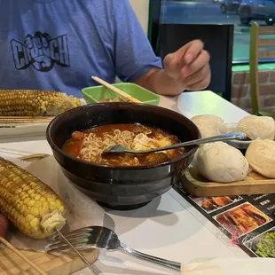 a man sitting at a table with food