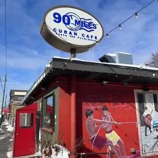 a sign for 90 miles cuban cafe