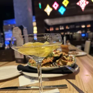 a martini with a slice of lemon