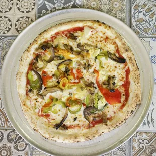 a pizza with vegetables and cheese