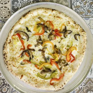 a pizza with peppers and mushrooms