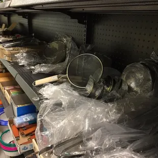 a shelf full of cooking utensils