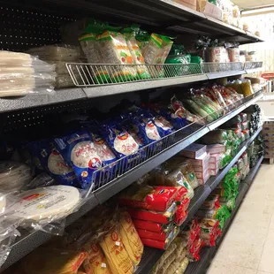 shelves of bread, bread rolls, and other foods