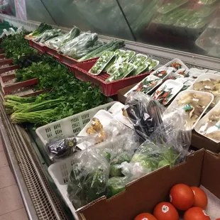 a display of vegetables and fruits