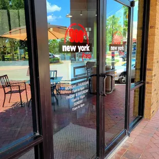 Aug 2021: Exterior Pic 2 of 4-- Entrance w/ posted hours