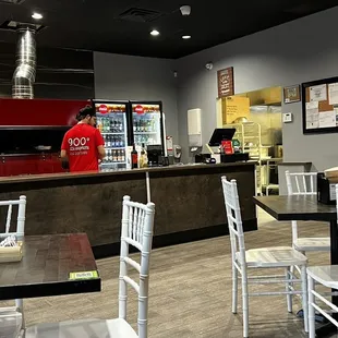 a restaurant with tables and chairs