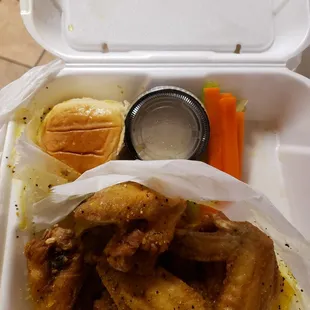 Lemon pepper wings and carrots with a roll and ranch dressing