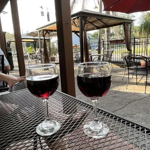 two glasses of wine on a table