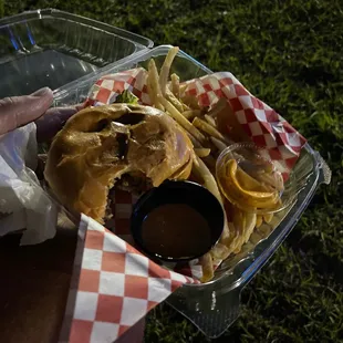 a person holding a container of food