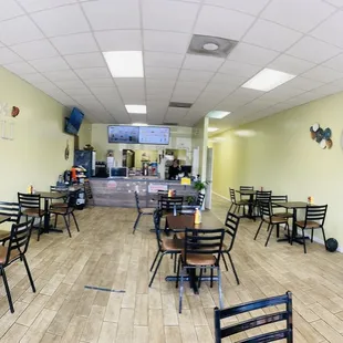 a restaurant with tables and chairs