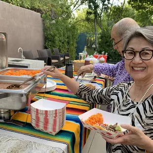 Our guest enjoying the buffet, and loved their colorful runners and very nice serving dishes.
