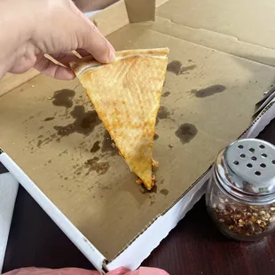 Pizza slice much less greasier than expected :) delicious