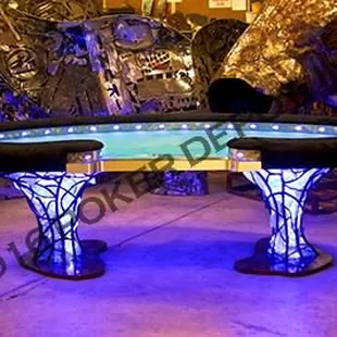 The Jewel Custom Poker Table Jewel Case Kidney Bean Shaped Table Table dimensions are 56″W Wide X 110″L Solid steel base bars custom jewel c