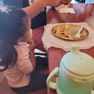 Melona popsicle actively getting destroyed by my toddler after we destroyed 2 orders of chicken.