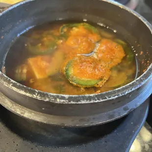 Tofu soup with jalapeños.