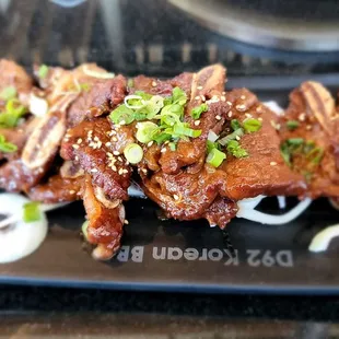 Galbi - Grilled prime beef short ribs marinated in korean sauce.