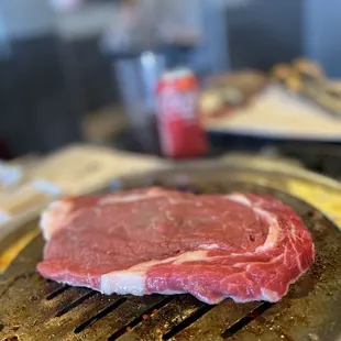 a steak on a grill