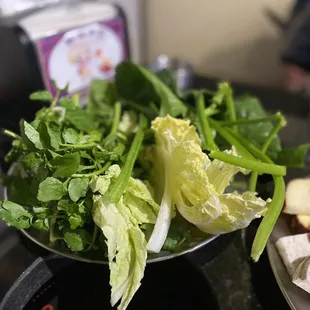 Water cress, spinach, and Napa cabbage.