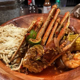 Pound shrimp, pound crab, and sausage with potatoes and corn. Oh, and garlic noodles.