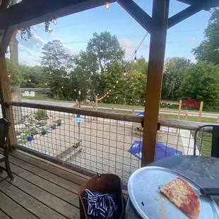 a pizza on a plate on a patio