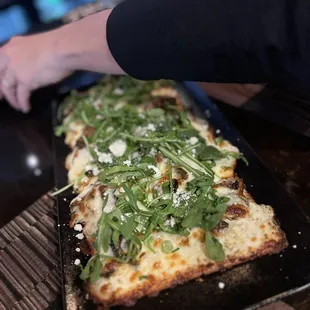 Delicious gluten free mushroom, arugula and goat cheese flat bread