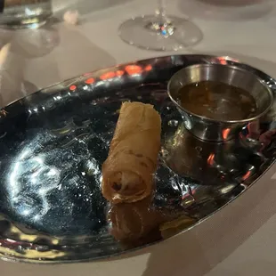 a plate of food and a glass of wine