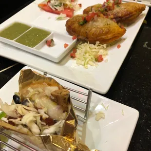 Beef epinadilla or something. And mahi mahi tacos in the foreground.