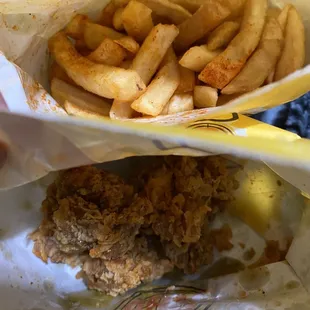 a basket of fried chicken and french fries