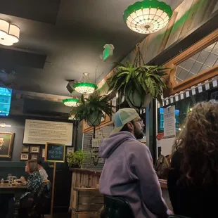 a man sitting at a table in a restaurant