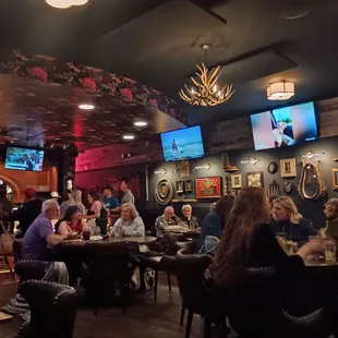 a large group of people sitting at tables
