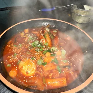 Ttubboki with ramen noodles .  That's the steam from the dish, not a dirty lense.