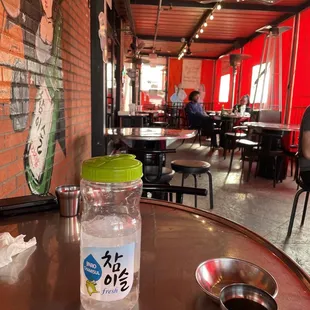 a jar of water on a table in a restaurant