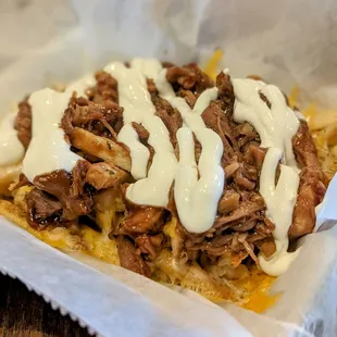 April 29, 2023; Pulled pork loaded fries ($10).