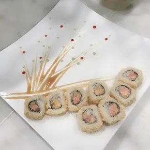 a plate of sushi on a table