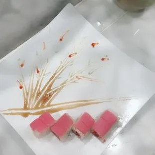 a plate of sushi on a table