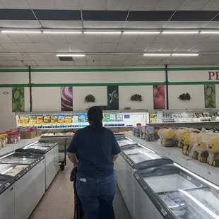 a man standing in the middle of the aisle