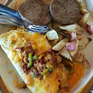 The chorizo omelette with potatoes and a side of sausage.