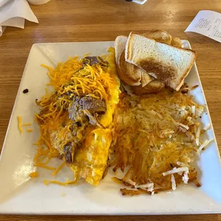 Brisket omelette with hash browns and toast.
