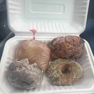 Brioche cranberry filled, honey roasted rhubarb fritter, espresso cake donut and ricotta cake donut with thyme sugar.