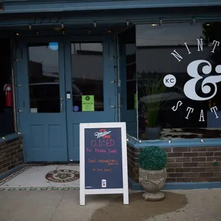 a sign in front of a restaurant